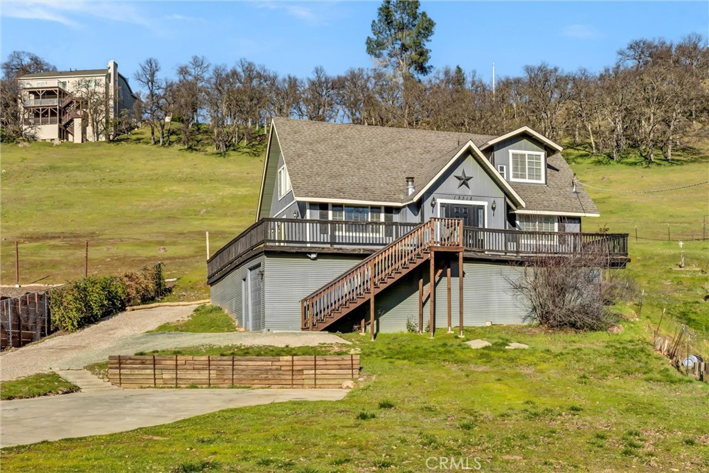 Updated & Affordable! This unique A-Frame home offers 3 beds/ 2 baths and 1,374 SF of spacious living space with an open-concept layout and fresh updates throughout, making it the perfect blend of comfort and style. The heart of the home boasts a renovated kitchen with sleek, contemporary finishes. Enjoy the convenience of newer stainless steel appliances, plenty of storage cabinetry including a separate pantry, and expansive countertops, ideal for meal prep and entertaining. The large island provides additional space for seating and prep work. You will love the 2-story ceilings, creating a bright and airy atmosphere. The large living room with laminate flooring & ceiling fan flows seamlessly into the dining area and kitchen, providing the perfect space for gatherings and entertaining. Both bathrooms have been updated with newer vanities, stylish fixtures, and contemporary tile work. The versatile upstairs loft space has been converted into a functional primary bedroom with adjoining bathroom including a spacious tiled walk-in shower. Stackable laundry located on the main level of the home for convenience! Outside you will find plenty of parking including room for several vehicles, RV or a boat. Enclosed area under the home makes for great storage or even a workshop! Brand new roof just completed at the end of 2024! Hidden Valley Lake is a welcoming community located just 20 miles north of Calistoga. Enjoy access to the lake, perfect for boating, fishing, and leisurely days spent by the water. The neighborhood also offers a golf course with driving range, parks, hiking trails, community pool and tennis/pickleball for residents to enjoy. This home is located in a peaceful, private setting, yet conveniently close to local grocery stores, schools, and restaurants. Schedule your viewing today!