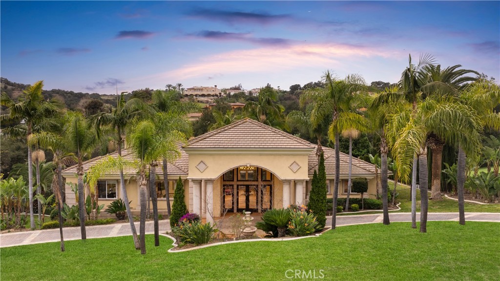 Luxury custom built, Living Space: 7,200 sqft, Lot Size: 37,000 sqft, 5 Bedrooms, 4.5 Bathrooms, 4-Car Garage, circular driveway. Nestled in the exclusive Oak Tree Downs community. Grand entry with soaring ceilings, marble flooring, and striking architectural columns. Gourmet kitchen with rich wood cabinetry, granite countertops, and top-of-the-line stainless steel appliances, built-in SubZero refrigerator, Thermador double ovens, KitchenAid built-in microwave, and Gaggenau steamer. Spacious island and expansive windows for natural light. Formal dining room with custom chandelier. Family room with built-in entertainment center and cozy fireplace. Primary bedroom with hardwood flooring and spa-like en-suite bathroom with soaking tub overlooking breathtaking views. Downstairs library and entertainment room with floor-to-ceiling bookshelves, fireplace, and built-in entertainment center. Game area with drum set and game table. Wet bar and large wine cellar. Custom two-tone paint, recessed lighting, and luxurious curtains that add to its sophisticated charm. Elegant marble flooring flows throughout, enhancing its grandeur and sophistication. Outdoor kitchen with granite countertops, built-in BBQ, and premium appliances. Resort-style backyard with lagoon-inspired pool, lush tropical landscaping, and grand covered patio with elegant columns. Premium corner lot, super large backyard with trees and flowers, private and peaceful path. Located in the gated community of Oak Tree Downs, offering an unparalleled lifestyle of luxury and convenience.