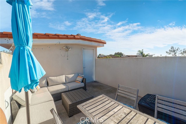 Roof top Deck to enjoy gorgeous sunsets and ocean views. Facing the door leading into the home.