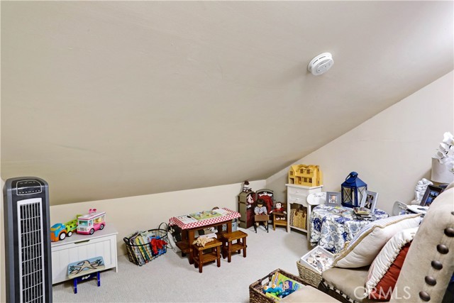 Additional storage/play room/extra space connected to the primary suite.