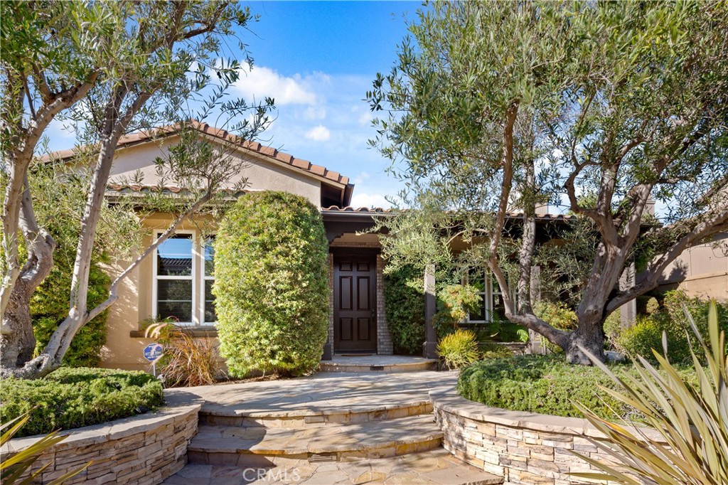 31442 Paseo Diosa San Juan Capistrano, California Welcome to 31442 Paseo Diosa - a gorgeous coastal enclave located in the highly desired & very private Rancho Madrina community. Your new luxury home features a main level primary suite floor plan with all of the benefits of a single story home & the added bonus of additional guest rooms & living space on the second level. From the gorgeous dark hardwood floors guiding you through the main level to the warm finished custom mouldings & woodwork throughout, this home has so much to offer. Located away from the main living areas of your new home is the perfect home office with custom built-in's & the added flexibility of a Murphy bed. Also at the front of the home, the living room, featuring a gorgeous fire place, makes a stunning first impression. At the center of the lower level is the interior courtyard with an outdoor fireplace & accessed by both the formal dining room & family room - perfect for indoor/outdoor living & entertaining. Your new home also boasts an open concept gourmet kitchen design with high end chef grade appliances, butler’s pantry, & a spectacular oversized center island as well as a convenient breakfast nook. Flowing from the kitchen is the family room with cozy raised hearth fireplace & built-in's for all of your media components. One of the key features of this home is the main floor main suite with separate sitting area, a spa caliber bath with dual shower heads, split vanities & large jetted tub, as well as an oversized walk-in closet with the perfect custom built-in's for optimal storage. Your second level does not disappoint with 3 more spacious guest rooms & 2 bathrooms (1 is a Jack & Jill serving 2 guest rooms). And to make it even more amazing, the upstairs bonus room is currently configured as a theater room with custom drop down big screen & a full home theater AV system. Enjoy time with family and friends in your completely private backyard with multiple seating areas & built-in BBQ. Other fabulous features of your new home include upgraded slab stone counters & finishes in all bathrooms, custom plantation shutters throughout, upgraded warm finish wood interior doors, & all new interior paint. Rancho Madrina is a highly desirable community just a short distance to St. Margaret's School & J Serra High School, Marbella Country Club, downtown San Juan Capistrano (hear the Mission bells!), restaurants, shopping, 5 freeway access, equestrian facilities, Orange County beaches, schools, & so much more. Your best life starts here!