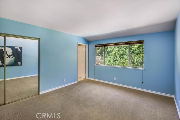 This bedroom is in the middle of the three rooms on the top floor. It has an attached full bath.