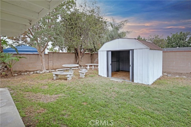 Sitting Area and Large Storage Shed in backyard