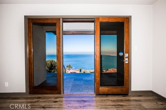 Master suite open to balcony with ocean view