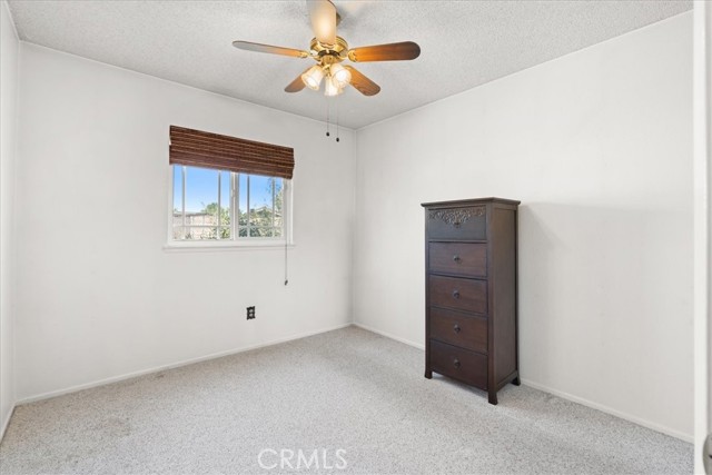 second bedroom on left of hallway looking out towards backyard