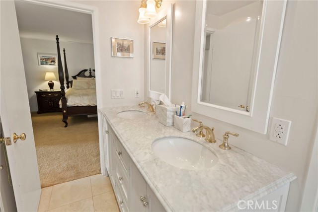The ensuite bathroom was renovated about 10 years ago and has double vanities, gold fixtures and separate soaking tub and walk in shower.