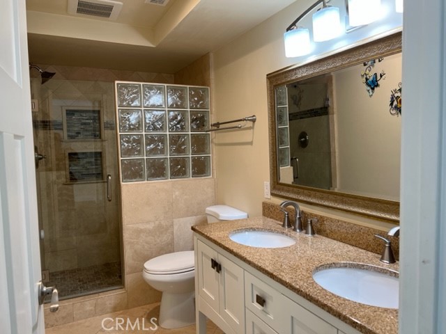 Primary bathrooom has double sinks and a large walk in shower