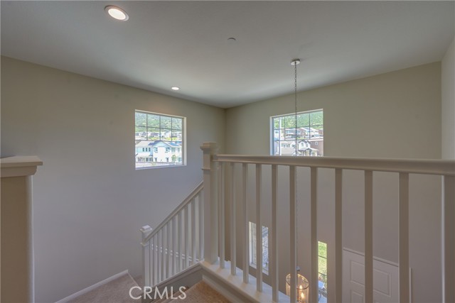 Landing at Top of Stairs Leads to Large Loft