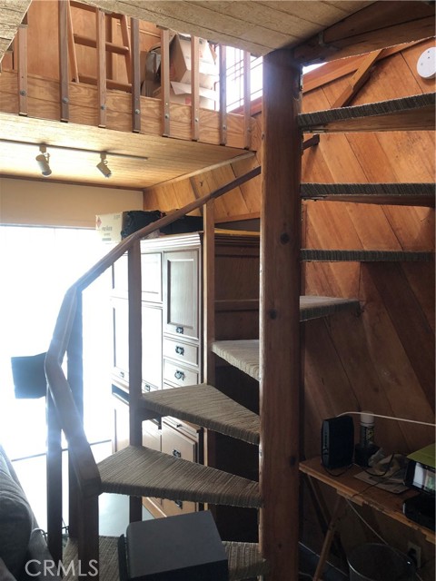 Staircase going up to master bedroom
