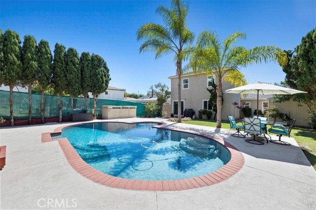 Nice patio areas in backyard and around pool.