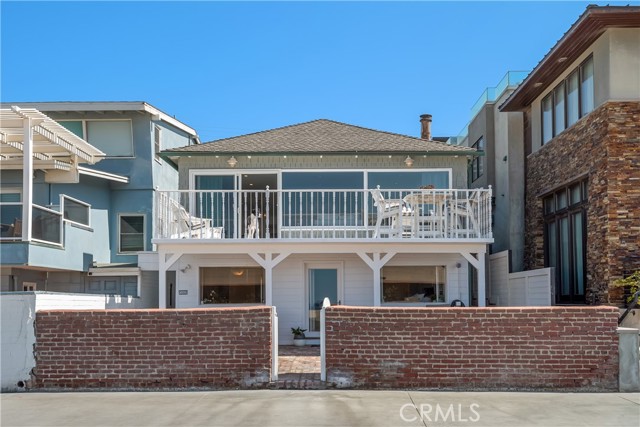 3007 The Strand Hermosa Beach, California Situated on a gorgeous stretch of The Strand in North Hermosa Beach, this grey-shingled, updated duplex features two units in 2502 square footage on the sand. Ocean views don’t get better than this, and with the Pacific providing the perfect background to your every view, this property, with its red brick patio and coastal interior, is an exclusive opportunity for those seeking the best location possible. The front unit houses three bedrooms and two baths, with a whitewashed living room and wide deck overlooking the beach, a tucked-away family room, full dining area, and darling kitchen with cozy breakfast nook. Amenities such as an inviting fireplace, custom built-ins and bleached oak floors envelop the space in warmth and cheer. The primary bedroom and bath and a second bedroom are at sand level, with a generous patio just steps outside the doors. The bathroom is bathed in sunlight and includes a lavish soaking tub for warming up after a dip in the ocean. The third bedroom and office space on the second floor are charming and convenient to hosting and working from home, and the barbecue patio hosts a built-in cooking station. The second unit is a perfect in-law or guest house, including a spacious family room with cathedral ceiling and original brick fireplace, full kitchen with stainless appliances, ¾ bath and brightly lit bedroom. With two separate living spaces and a location second-to-none on the Strand in Hermosa Beach, this property is an absolute gem.