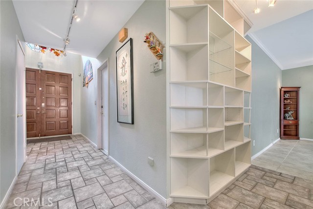 Main Hallway From Front Entry Leading To Living & Dining Rooms & Kitchen.  Beautiful Easy Care Tile Flooring.  Built-In Display Case For Books, Art Pieces, Etc.