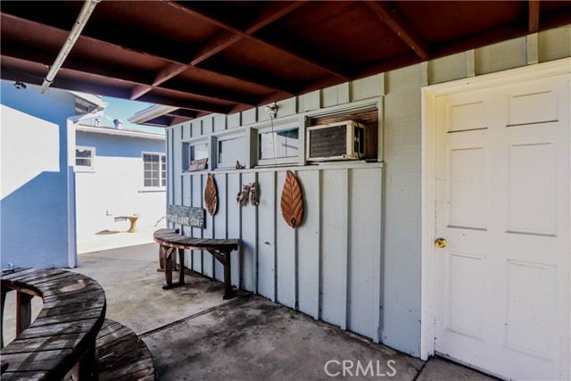 Door to Studio that is attached to the garage, has a fireplace & Window AC