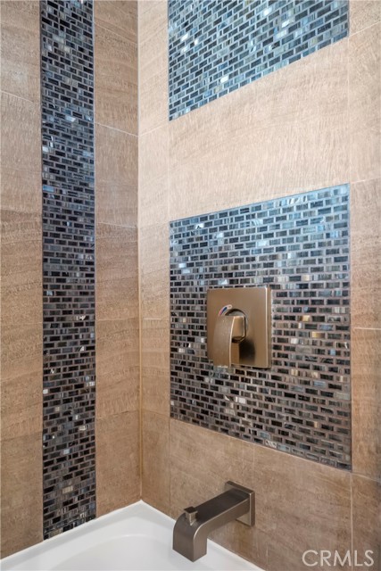 Beautiful tile detail in the upstairs bathroom combo shower/tub