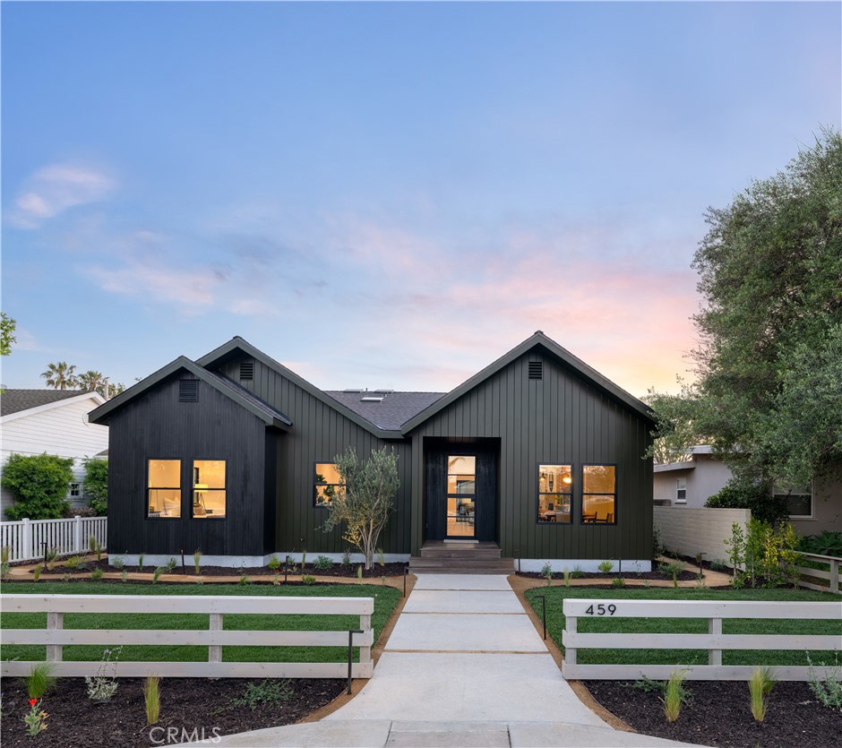 Welcome to BLKHOUZ on 18th Street — where heritage meets modern coastal living. This brand-new Eastside Costa Mesa home blends timeless charm with master craftsmanship, offering 4 bedrooms, 4.5 baths, and 2,733 sq ft of thoughtfully designed space, including a fully equipped ADU. Just steps from 17th Street shops, Newport’s Back Bay, and prime beaches, the home features Hemlock siding, an iron Dutch door, and 18-foot cathedral ceilings with skylights. The chef’s kitchen boasts white oak cabinetry, Viking appliances, handmade tile, and a slate island with Taj Mahal quartz. The living room's custom built-ins and volcanic stone fireplace create a warm, modern vibe flowing into a cozy California room. Step outside onto the beautiful hardwood deck accompanied by lush landscape, perfect for entertaining and enjoying sunsets by the beach-like fire pit. The luxurious primary suite includes dual walk-in closets, soaking tub, skylit shower, and spa-like finishes. Each bathroom offers unique designer touches. The ADU provides flexible living with a full kitchen, quartz counters, and chic main room. BLKHOUZ on 18th isn’t just a home — it’s a lifestyle rooted in the heart of Eastside Costa Mesa.