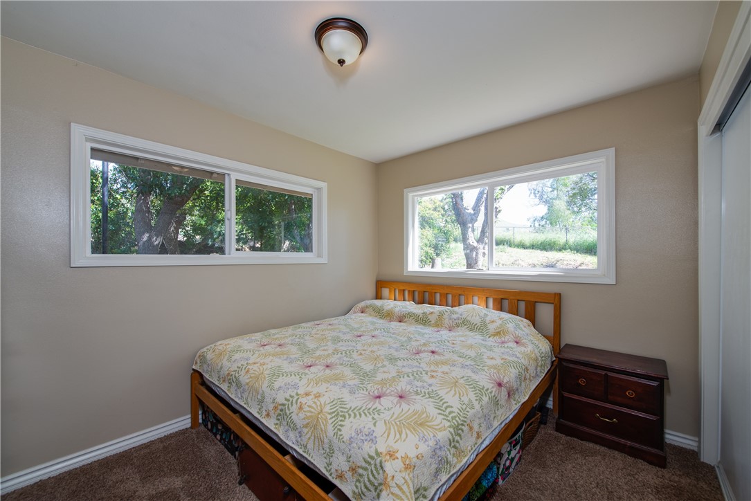 Bedroom 3 is roomy and in the back of the home and has two large framed dual paned windows to let the natural light flow throughout and a large closet.