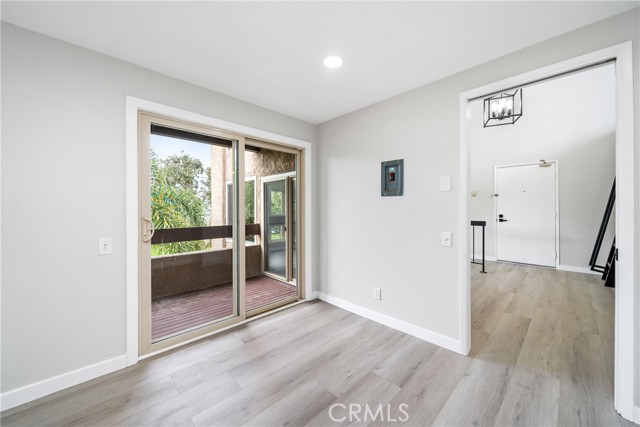 Off the kitchen and dining area there are glass sliding doors to a private balcony!