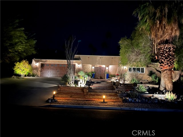 Beautiful South Palm Desert, Santa Fe style home with desert landscaping. The unique Front wooden French doors open to a large courtyard, with Entrance to the living room with a gas fireplace that has granite surround. This warm feeling home has very large rooms, the primary closet is large. 12 Pella sliders, 6 that open to the courtyard. Stainless steel appliances. The side driveway is gated and will hold an extra car, boat, trailer or maybe a small RV. Eat in kitchen with a breakfast bar and a formal dining room. Very private walled backyard to keep a dog inside. A large pool and covered patio area. The entire yard has Desert landscaping. Very Close to El Paseo and Mountain trails. The middle bedroom (2nd) is being used as a workout room. The 3rd bedroom is large enough for a small kitchenette and has a separate entrance facing the pool. The last pictures are of the courtyard (day and night). Great neighborhood, nothing cookie cutter here. Views of the Mountains from the yard. Drive by at night to see the lighted landscaping, it's Beautiful!!