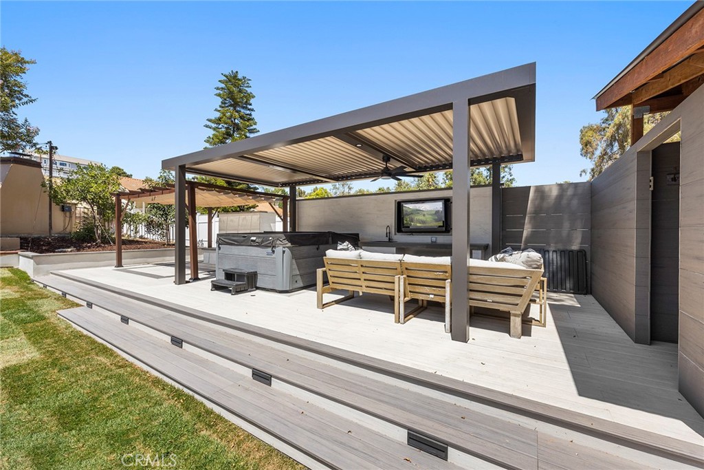 This area was recently built to enjoy the spa,enjoy TV, watch the kids play basketball
Or enjoy a dog grooming station that is set up for the other family members. Outdoor shower.
Louver remote patio cover, allows the SUN when u want it.