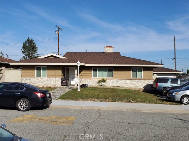 2052 Armour Street Pomona, California Great Opportunity!! Location, location, location!! This property is located in the North Pomona area near to the Pomona Fairplex, San Dimas Downtown, Claremont colleges, University of La Verne, Raging Waters Park, Pomona Valley Hospital, Freeways I-10 and 57. This 7,940 sq ft property adjoins at the back with the La Verne Science And Technology Charter School. This corner lot contains a 2,122 sq ft construction with 4 bdrm's and 2 baths, an spacious living room accentuate with a fireplace, the open kitchen has plenty of cabinet space, a very cozy dining room and a large Den that you can warm with a second fireplace, additionally laundry room and a private back yard. The 2 car garage is detached from the house.