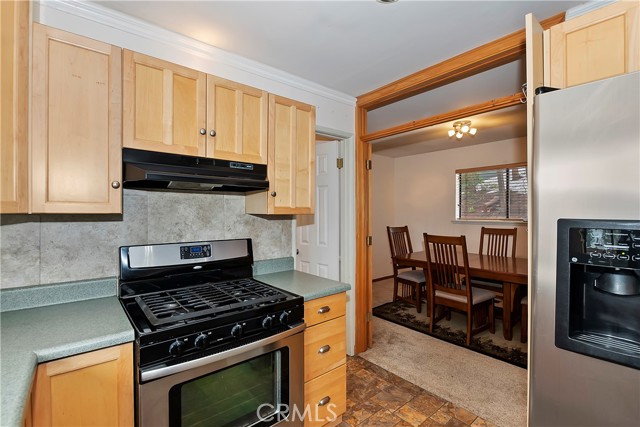 kitchen and view of main level bedroom