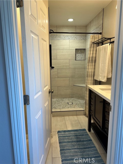 Remodeled primary bath with walk in shower.