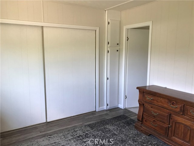 Master bedroom featuring new laminate flooring