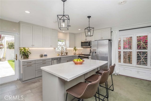 Open kitchen concept! under cabinet lighting, recently renovated... Glass door leads to a big, private, fun backyard!