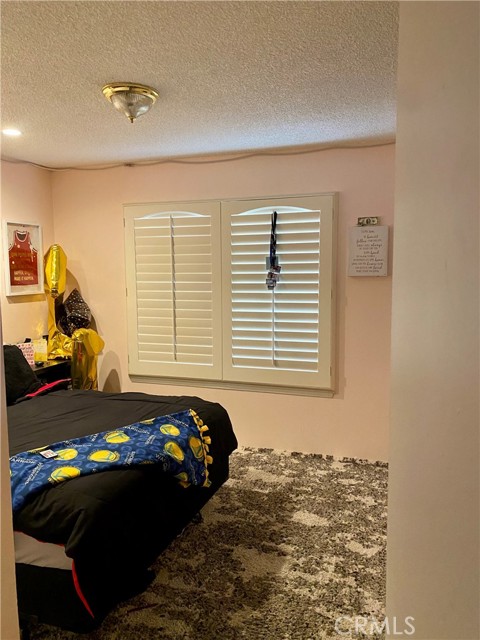 Bedroom #2 w/plantation shutter.