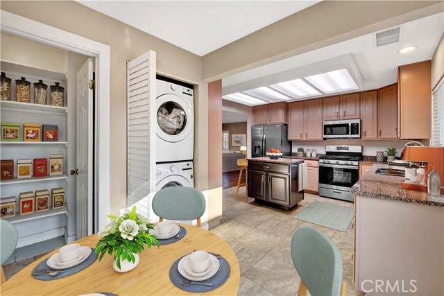 Kitchen, showing breakfast nook pantry, and washer/dryer.