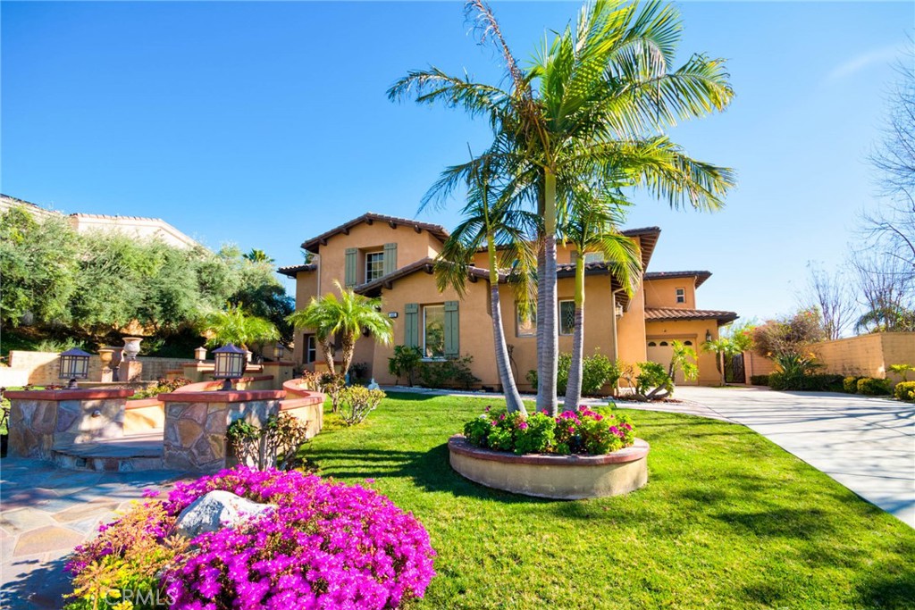 Welcome to the pinnacle of luxury living! This approximately  1/2-acre estate and meticulously maintained property has breathtaking city, canyon, and mountain vistas. It is a sophisticated 5315 sq ft house with 5 bedrooms and 5 1/2 bathrooms. Upstairs has the master bedroom with custom design wooden cabinets, marble countertops, and walk-in closets. 3 bedrooms each have their own bathroom.  
Featured within this modern masterpiece, a gourmet kitchen, family room, formal dining room, formal living room, den/playground and mother-in-law suit, all downstairs.  Windows have custom design drapes and ceiling fans in all rooms.  Outdoors compliment the majestic panoramic views and achieve the resort-style atmosphere with a salt water pool and spa, golf putting green and custom barbecue island with granite countertops. The three-car garage has California closet cabinets. 
The house has a paid off SunRun with 48 solar panels. Water softener and reverse osmosis water filter in the kitchen, iron wrought gate, and state of the art security cameras. This hilltop sanctuary is a breathtaking private oasis offering the ultimate luxury lifestyle of elegance and solitude.