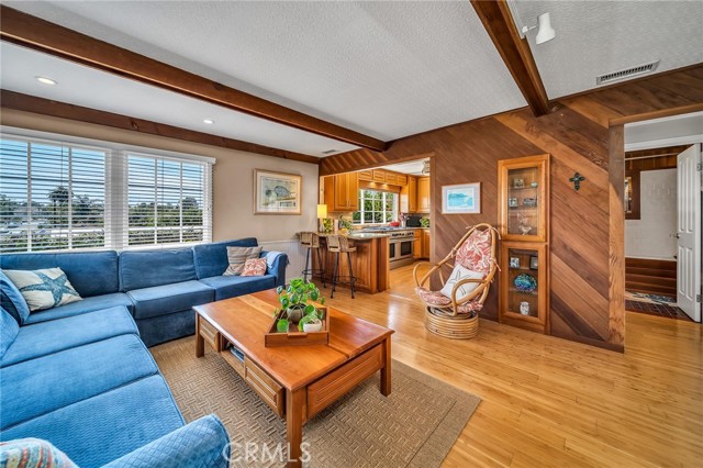Light and bright living room opens to kitchen