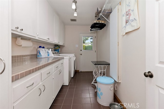 Laundry Room With Door To The Backyard