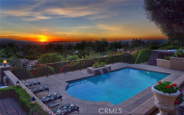 Stunning Single Story View Home in Anaheim Hills!!! This Beautiful Home is an Entertainer's Dream with its Panoramic Views, Remodeled Pebble Tec Pool, In-ground Spa, Built in BBQ with eating area, Gas Fire Pit, & Gorgeous Decking! There are steps that lead down to an additional grassy area that connects to the horse trails. Disneyland Fireworks can be seen every night! No expense was spared when this single story home was remodeled. The kitchen is gorgeous & features granite countertops, tall white cabinets, large island, 6 burner gas stovetop, double oven, microwave, dishwasher, & large dual pane windows that look out to the beautiful view! The home features raised ceilings that have gorgeous beams & quality finish work. There are 3 Bedrooms & an office that could potentially be converted to a 4th bedroom. All 3 bathrooms have been remodeled and feature high quality cabinetry & countertops. The family room & living room have a double sided fireplace & new laminate flooring. In addition to the 3 car garage, there is a gated 52' RV parking area with hookups. There is additional parking on the other side of the house next to a large shed for storage. The home has 2 AC units & a whole house fan. This beautiful ranch style home sits on a private street with no one on the other side of the road. It's a one of a kind dream home!!! Stunning Single Story View Home in Anaheim Hills!!! This Beautiful Home is an Entertainer's Dream with its Panoramic Views, Remodeled Pebble Tec Pool, In-ground Spa, Built in BBQ with eating area, Gas Fire Pit, & Gorgeous Decking! There are steps that lead down to an additional grassy area that connects to the horse trails. Disneyland Fireworks can be seen every night! No expense was spared when this single story home was remodeled. The kitchen is gorgeous & features granite countertops, tall white cabinets, large island, 6 burner gas stovetop, double oven, microwave, dishwasher, & large dual pane windows that look out to the beautiful view! The home features raised ceilings that have gorgeous beams & quality finish work. There are 3 Bedrooms & an office that could potentially be converted to a 4th bedroom. All 3 bathrooms have been remodeled and feature high quality cabinetry & countertops. The family room & living room have a double sided fireplace & new laminate flooring. In addition to the 3 car garage, there is a gated 52' RV parking area with hookups. There is additional parking on the other side of the house next to a large shed for storage. The home has 2 AC units & a whole house fan. This beautiful ranch style home sits on a private street with no one on the other side of the road. It's a one of a kind dream home!!!