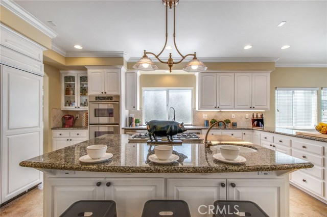 Gourmet kitchen with huge pantry and tons of cabinet and counter space.