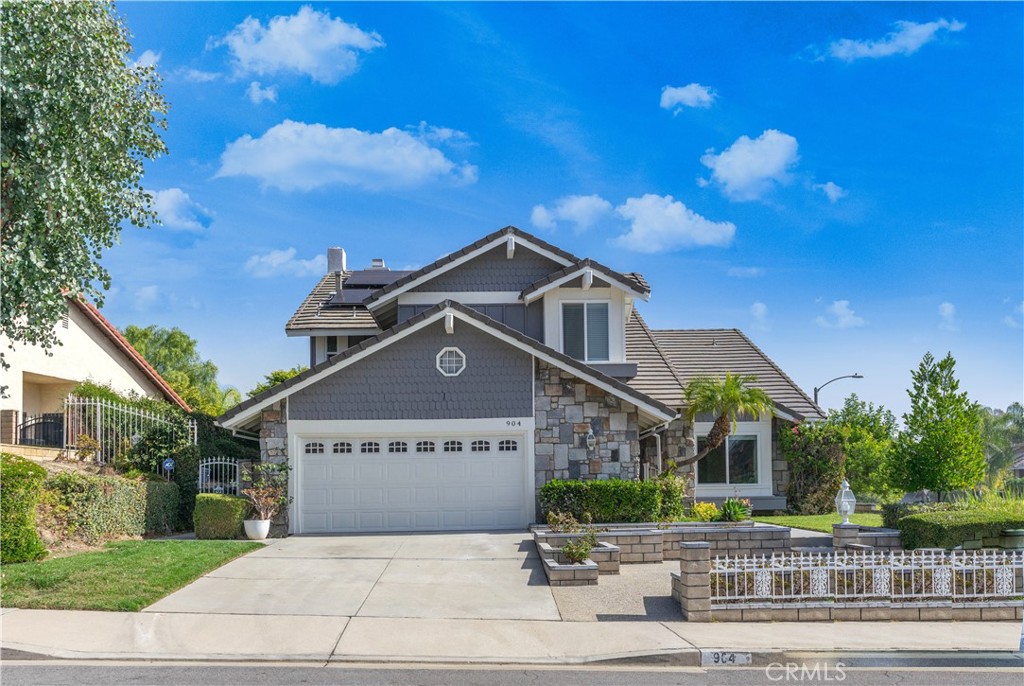 Welcome to 904 Sol Vista Way– this exquisite 3 bedroom, 3 bathroom 2,498 sqft home is nestled in the prestigious Walnut neighborhood. Perfectly situated on a corner lot walking distance from Creekside Park. Recently remodeled in 2022, this spacious 2-story gem boasts high vaulted ceilings, living room, family room, and formal dining room. Kitchen features granite countertops, stainless steel appliances, and tiled backsplash. New laminate wood flooring throughout the majority of the house. The high-ceiling master suite features a sitting area with a fireplace and an upgraded bathroom with a soaking tub and separate shower. Additional highlights include a separate laundry room, wet bar, a 2-car garage, and a lush backyard with an oversized hot tub. Enjoy the outdoor retreat with lemon and fruit trees, complementing the beautifully landscaped front and back yards. 
In the distinguished Rowland Unified School District, walk to the acclaimed Oswalt Academy (K-8). Conveniently close to Cal Poly & Mt. Sac, with easy access to the 60 freeway. Leased solar panels. Your perfect home awaits!