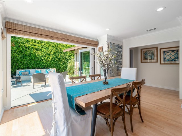 Informal dining in great room toward rear patio