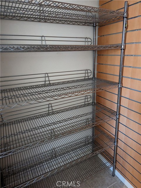 Closet with shelving and cedar planks.