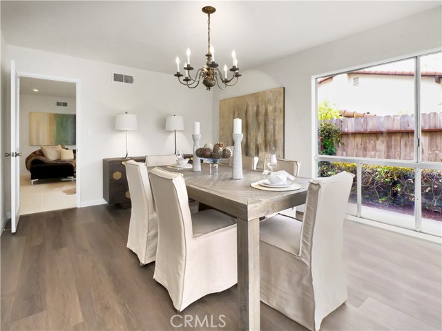 The formal dining room again with lots of windows opening to yard and ocean view.