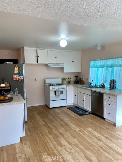 Kitchen is large enough for a dining table or add an island!