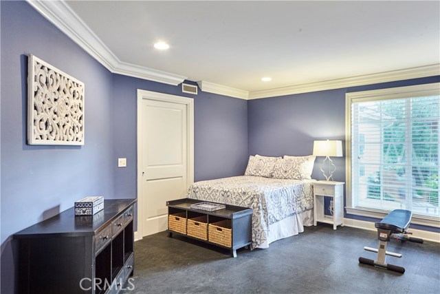 Workout room with rubber padded flooring, currently used as a guest room