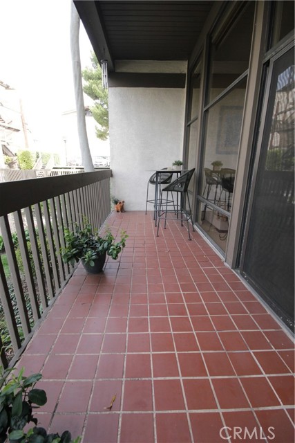 Extra wide 22' tiled balcony!  Perfect for barbecuing!