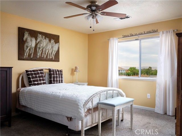 Master bedroom with views of the vineyards and hills