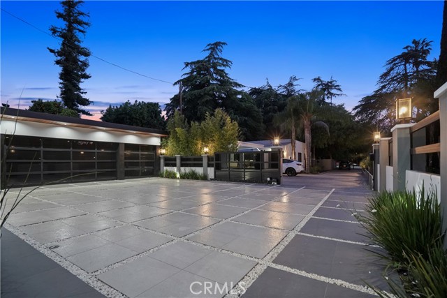The Gigantic Courtyard w/ 3 Car Garage, Ample Parking Space and the View of the Private Driveway & the Private Gate.