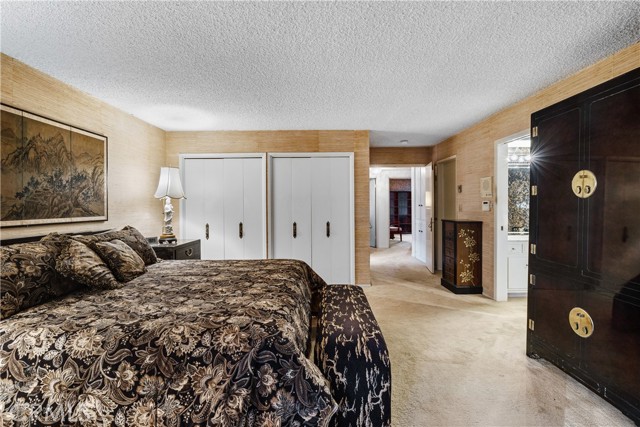 The main bedroom is a large suite with a large walk-in closet and wall closets.