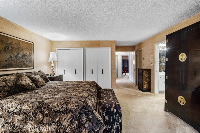 The main bedroom is a large suite with a large walk-in closet and wall closets.