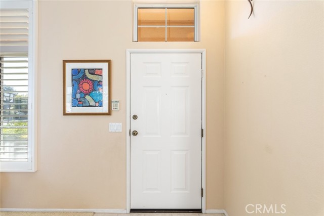 The open doorway offers a welcoming entry.