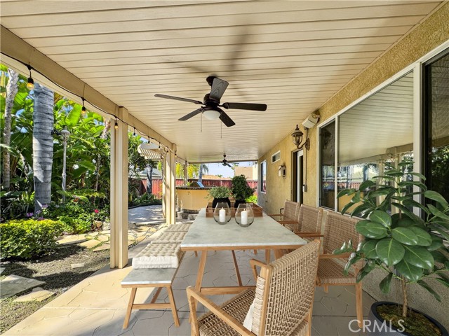 Rear outdoor living area space.Photos depict virtual staging and are not representative of current furnishings in the home.