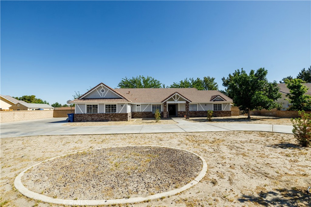 Here is your opportunity to own your ranch in the prestigious Rancho Tierra del Sol community in Lancaster. This unique and affordable  single-story house is situated on a 40,000 sq ft all fenced flat lot. 3Br+3Ba+Den( can be easily the 4th bed), Family Room with brick fireplace,Living Room, Laundry Room, central A/C, extended cover patio, custom built BBQ ranch, extra large 3 cars attached garage, open floor plan kitchen with center island.Master bath with hot tub, laminate floors, circular driveway with 2 gate entrances, huge gated  RV parking, it has spaces for all your RV's, utv's , trucks. Zoning LRRRR1: bring your horses!!. Quiet area, Seller motivated, Buyers do not miss this opportunity!!!