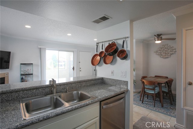 Kitchen sink faces the open area to the living room